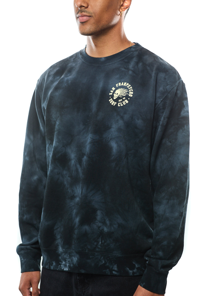 The individual wears the ultra-soft black tie-dye Surf Club Crewneck, showcasing the San Francisco Brew Club logo on the front and blending comfort with style in its distinct design.