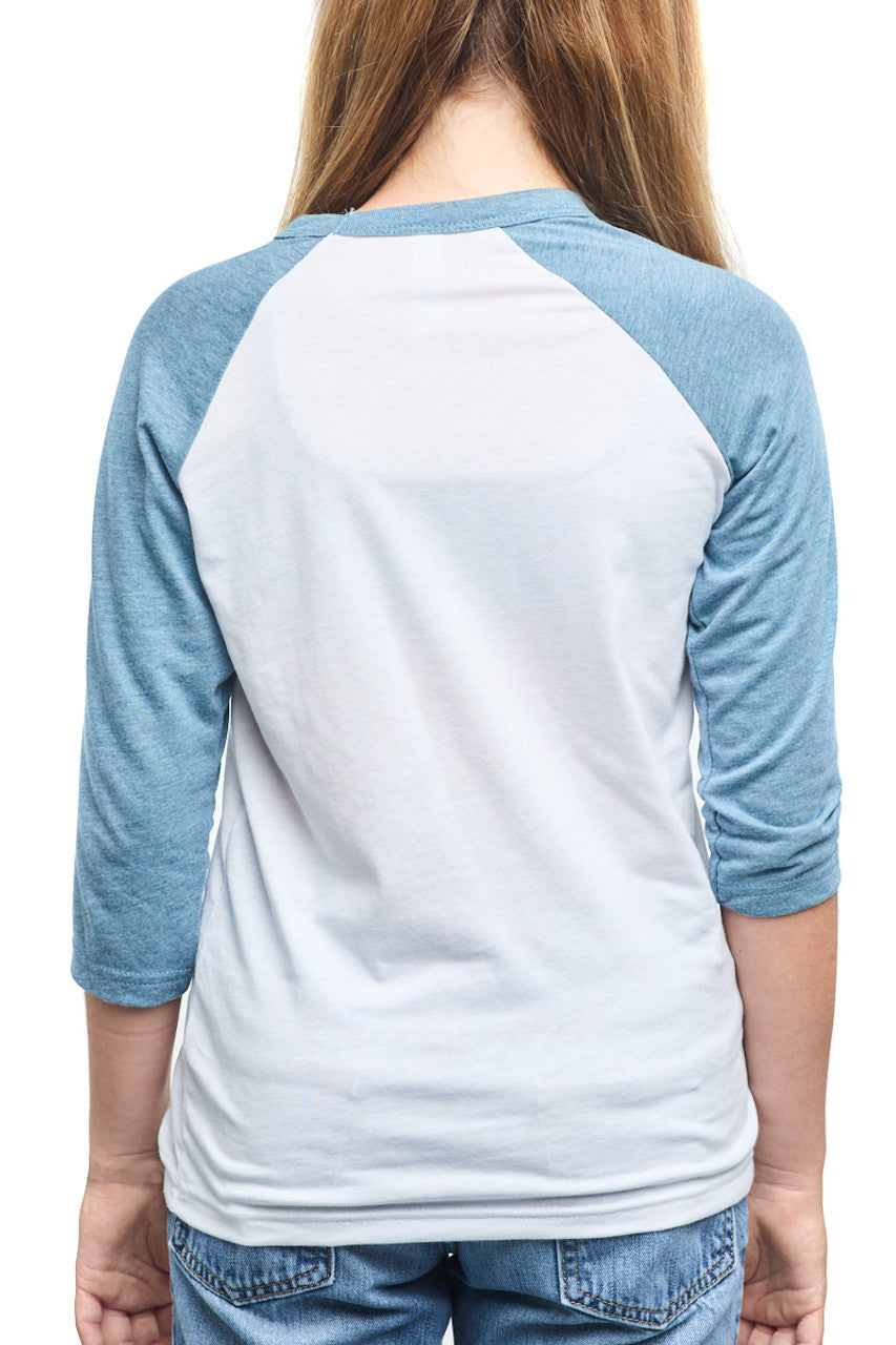 A person is seen from the back, wearing a Youth Seal Logo Baseball Tee in blue and white, made of 100% cotton, with three-quarter sleeves.