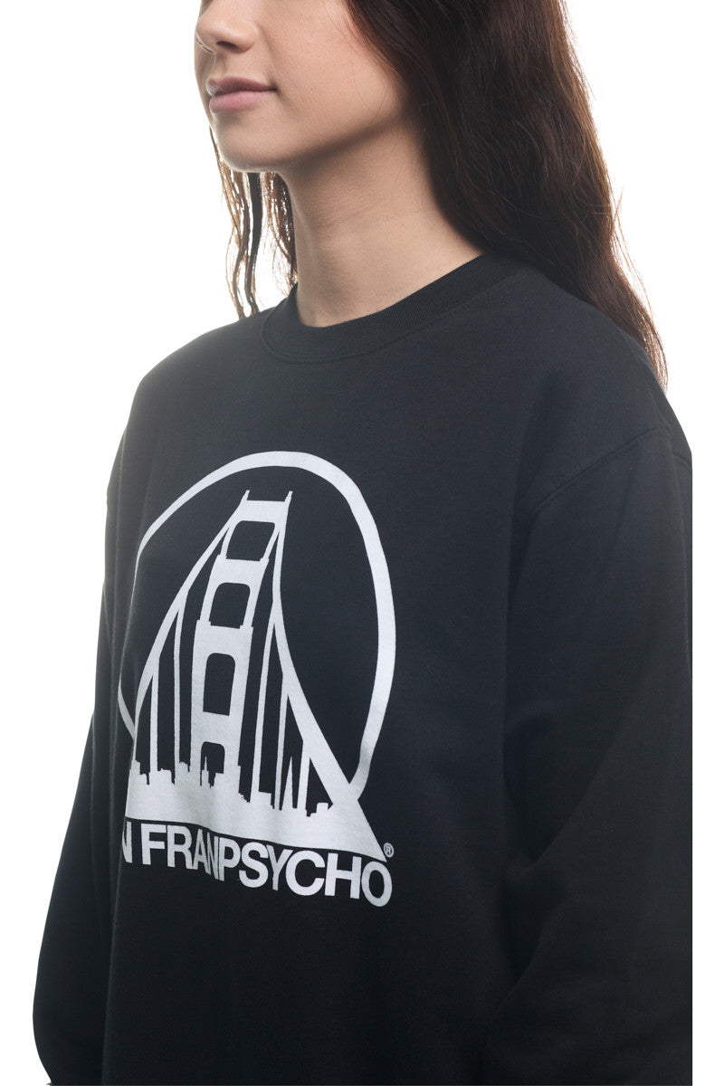 The individual is sporting the Black & White Logo Crewneck, a classic style black sweatshirt adorned with the SFP logo and a white graphic of a bridge accompanied by text below. It comes in multiple size options to guarantee the perfect fit.