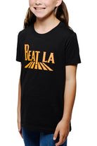 Smiling girl wearing a Youth Beat LA Tee - Black & Orange and blue jeans, showing off her Bay Area sports pride.