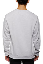 A person is wearing the Candlestick Champs Crewneck, a vintage unisex design, shown from the back against a white background.