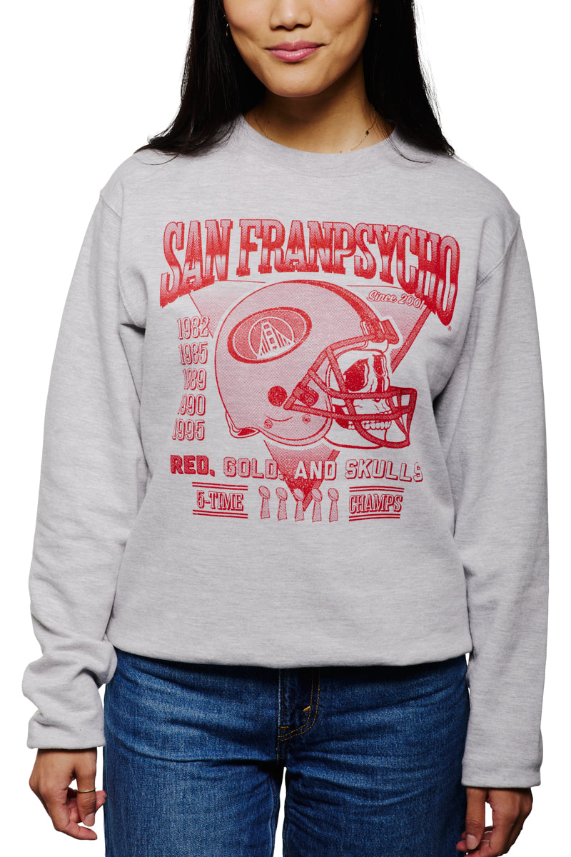 A person is wearing a gray Candlestick Champs Crewneck, featuring a red San Franpsycho football-themed graphic, perfect for the Niners season.