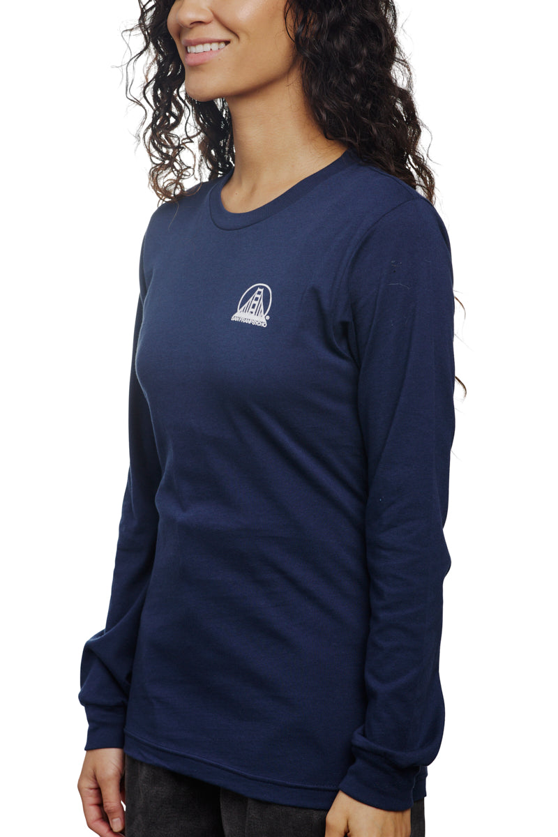A person wearing a Navy Long Sleeve Mini Logo, crafted from soft Airlume cotton with a small white chest logo, smiles facing left.