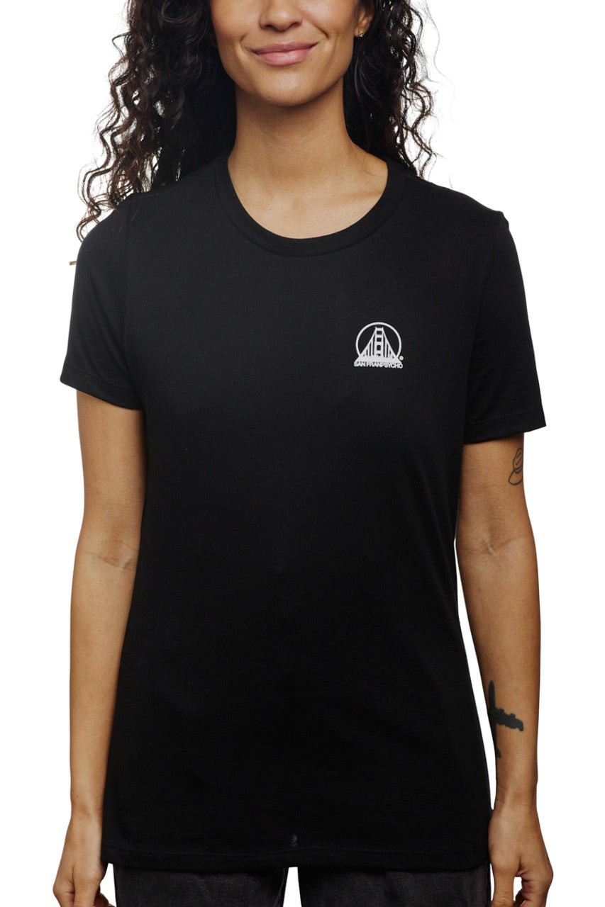 A person is wearing a Women's Mini Logo Tee in black from the basics line, standing against a plain background.