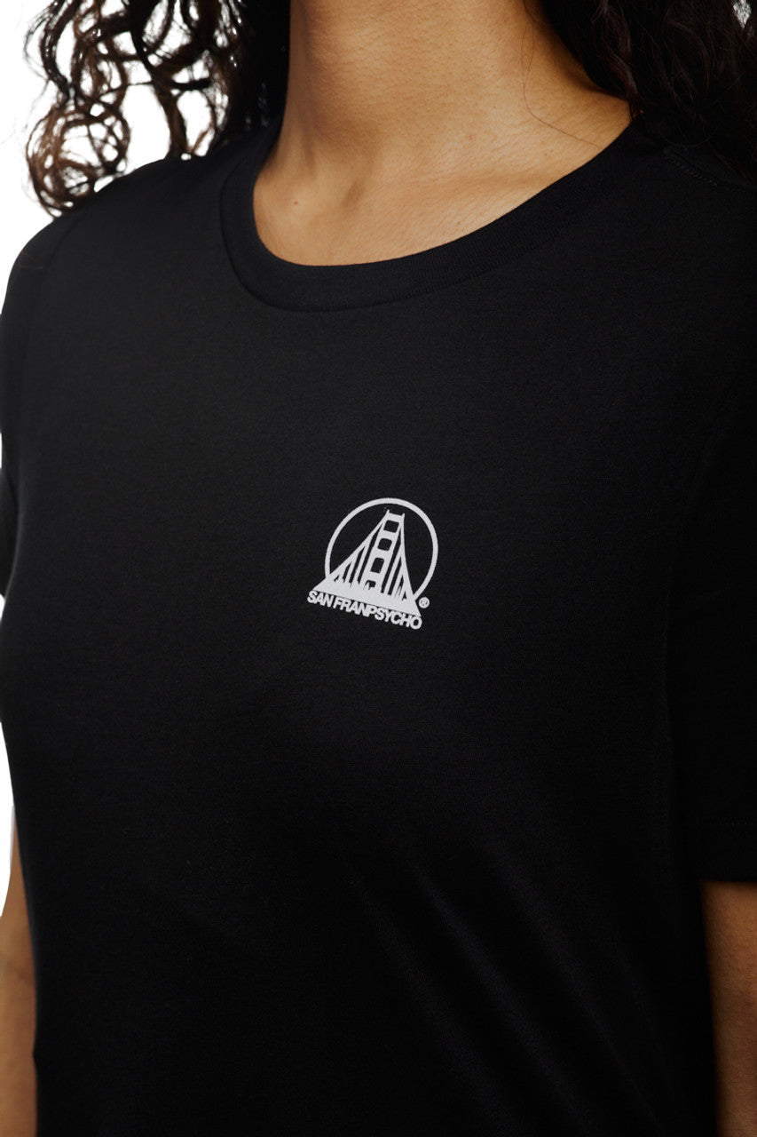 A woman wearing a Women's Mini Logo Tee from the basics line, featuring a white San Francisco bridge design in black.