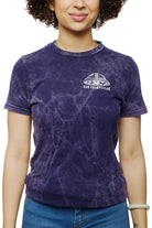 A woman wearing the Psycho Invader Mineral Wash Tee from the Spring 2023 Collection, showcasing San Franpsycho and an alien graphic on the front.
