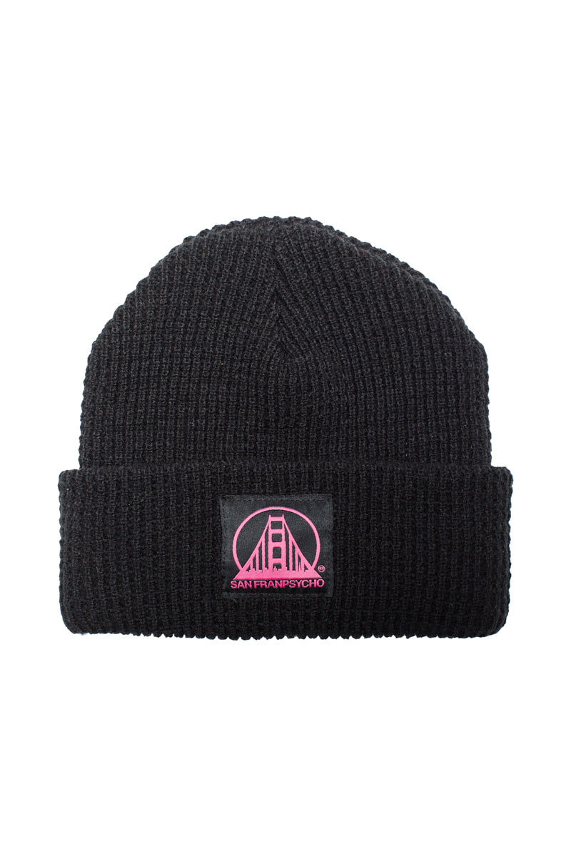 The Black Waffle Beanie w/ Black/Pink SFP Logo is made from 100% acrylic and showcases a chic pink San Franpsycho bridge logo on the front.