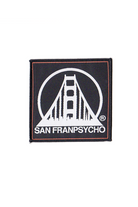 The SFP Logo Patch is an embroidered black patch featuring a stylized bridge design with crisp white "SAN FRANPSYCHO" text, ideal for use as an iron-on accessory.